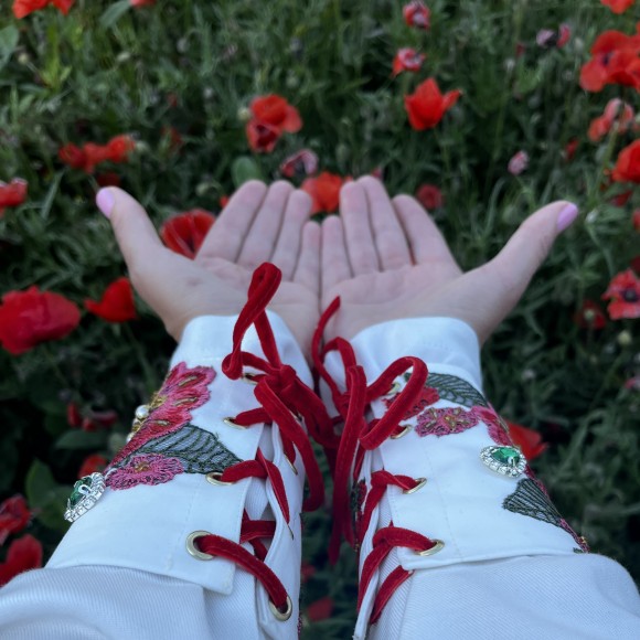 Lace-up cuffs with red flowers